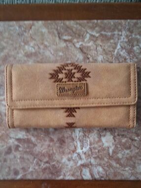 Wrangler tan wallet with embroidered tribal motif